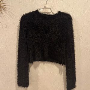 Selling this black fuzzy sweater with cut out sides that tie.